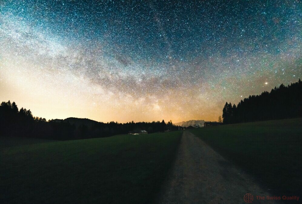 a beautiful apline landscape shot with the milky way in the background