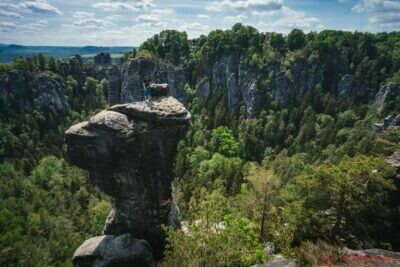 ferdinandstein with unrecognized climber in famous bastei national park saxon switzerland germany Transformative Leadership in Business - Navigating the Temptations of Business Expansion - Personal and Professional Growth - Chicago's Affectionate Humor - Embracing Uncertainty in Leadership