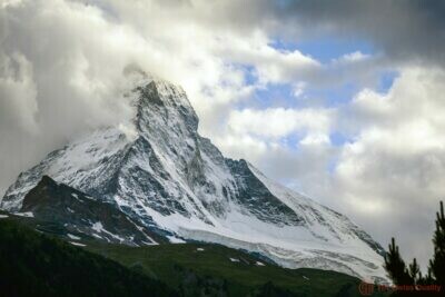 matterhorn mountain and cloudy sky zermatt switzerland Bridging Instinct and Intelligence in Business, Technology's Impact on Business, Strategic Time Management - Travel - Nature-Inspired Strategies - Peacemaking- Strategic Business Tools in the Middle East