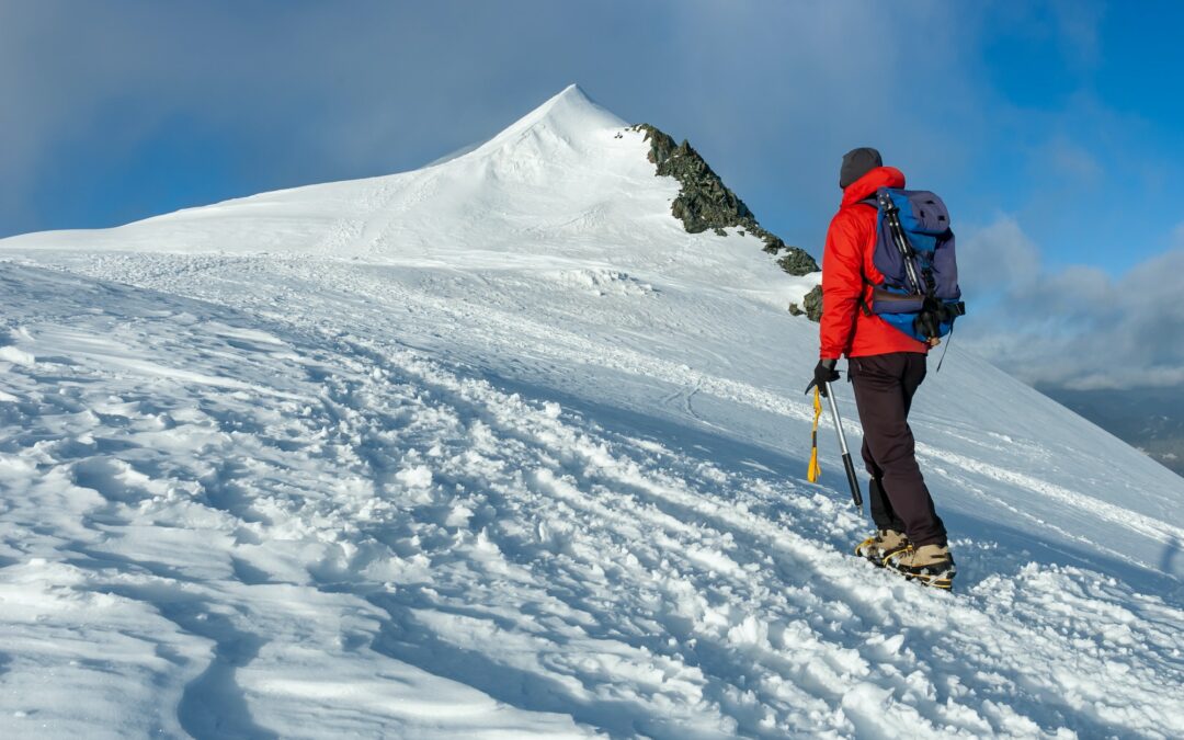 mountaineer climbs a snowy peak in swiss alps zermatt switzerland