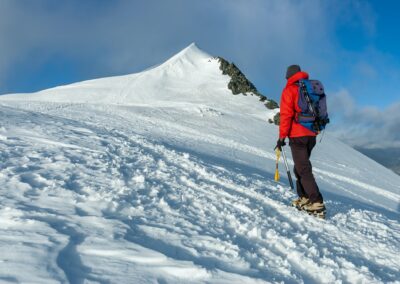 mountaineer climbs a snowy peak in swiss alps zermatt switzerland
