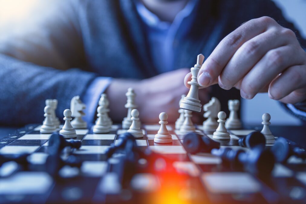 Understanding Your Business Core - depth of field photography of man playing chess