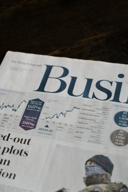 a newspaper with a picture of a man on it Unraveling Business