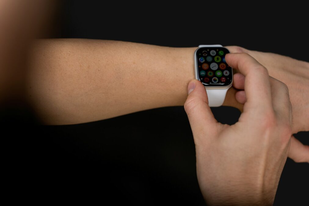 Punctuality in Meetings a person holding an apple watch in their hand